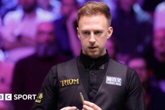 Trump through to UK Championship quarters with 'edgy' win