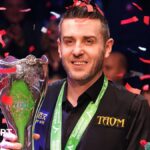 Selby holds off spirited Trump to win third UK title