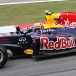 Norris shows off golden look as new champion returns to track