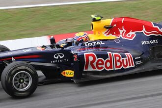 Norris shows off golden look as new champion returns to track