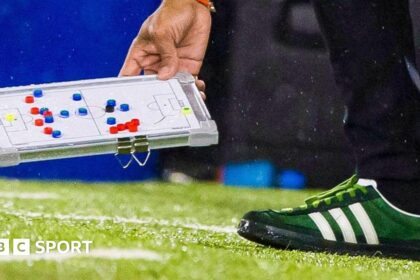 Why have Nancy's tactics board & green shoes caused consternation?