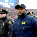 Fired Michigan coach Sherrone Moore accused of stalking victim 'for months' in police dispatch audio