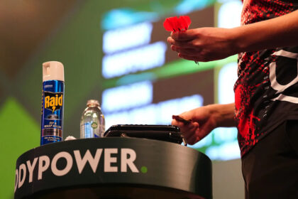 Darts player creates a buzz by bringing insect spray onto the stage at worlds