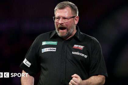 Wade cruises through but Van Barneveld knocked out