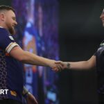 Rock beats Hayter to reach round two at PDC Worlds