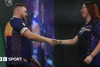 Rock beats Hayter to reach round two at PDC Worlds