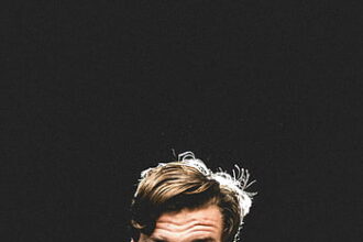 Ravens QB Lamar Jackson (back) exits early in loss to Patriots