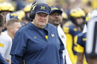 Interim coach Biff Poggi wants chance to fix 'malfunctioning' Michigan