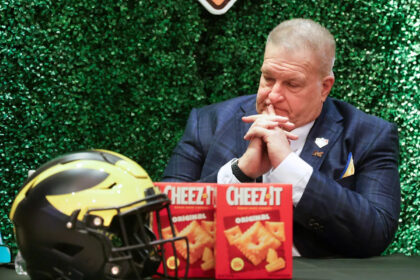 Michigan interim coach Biff Poggi wants to keep the job beyond bowl game and 'fix this program'