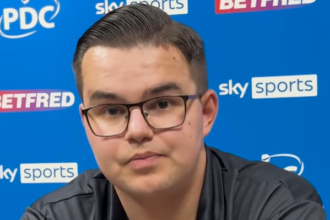 Littler thrashes Van Veen to retain World Darts Championship title