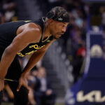 Jimmy Butler goes down, has to be helped off court with apparent knee injury