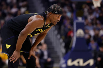 Jimmy Butler goes down, has to be helped off court with apparent knee injury