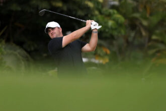 Who leads the PGA Tour money list going into the The American Express