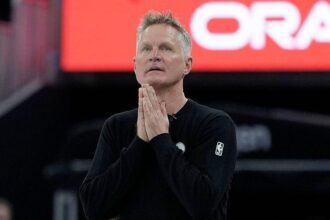 Warriors win 'bizarre, sad' game in 'sombre' Minnesota