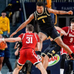 McKenney makes go-ahead layup as No. 3 Michigan hands No. 5 Nebraska its first loss, 75-72