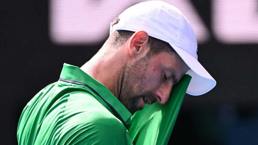 Djokovic scrapes into semis after Musetti injury