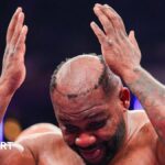 Miller hairpiece punched off during fight