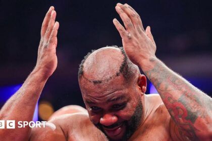 Miller hairpiece punched off during fight