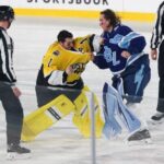 Bruins-Lightning goalie fight: Why Jeremy Swayman, Andrei Vasilevskiy brawled in Stadium Series game