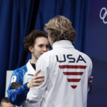 Ilia Malinin congratulates Mikhail Shaidorov after Olympic upset