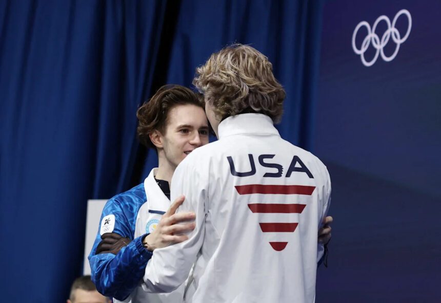 Ilia Malinin congratulates Mikhail Shaidorov after Olympic upset
