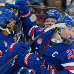 Photos show United States triumph to win third Olympic gold in women's hockey