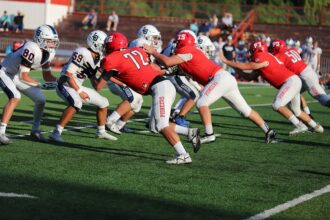 Lakers' LeBron James hurts elbow in loss to Nuggets