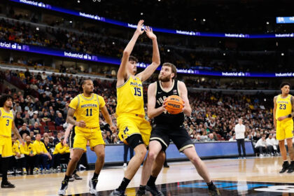 Cluff and Kaufman-Renn power No. 18 Purdue past No. 3 Michigan 80-72 in Big Ten final
