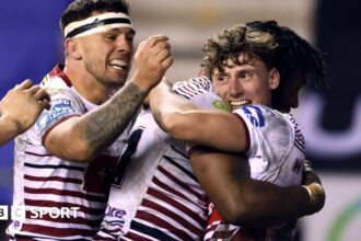 Leaders Wigan edge past York to extend 100% start