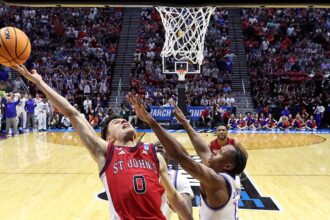 St John's sends Kansas packing with dramatic buzzer-beating layup in NCAA Tournament
