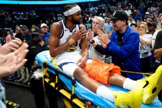 Warriors' Moses Moody leaves game on stretcher after suffering gruesome injury on dunk attempt