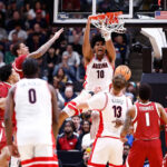 Top-seeded Arizona beats Arkansas 109-88 to reach the Elite Eight for the 1st time since 2015