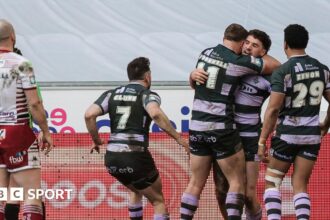 Bottom side Huddersfield beat leaders Wigan