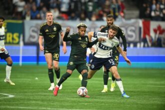 Vancouver scores twice in stoppage time to stun Portland