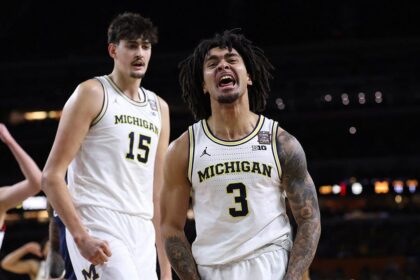Michigan holds off UConn to capture first men's basketball national title since 1989