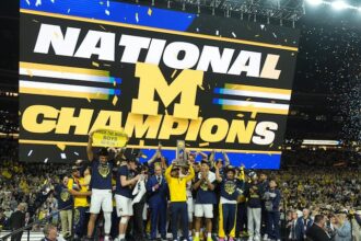 Michigan muscles its way to program’s 2nd national title, beating stubborn UConn 69-63