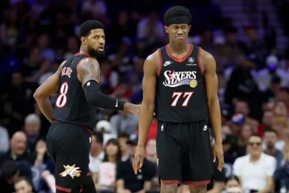 Fan drilled with errant pass while on her phone sitting courtside at NBA play-in tournament