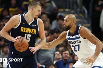 Jokic's triple-double draws Denver into contention