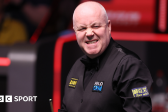 Higgins battles to level semi-final with Murphy
