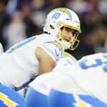 Mike McDaniel hopes to get QB Justin Herbert to "own the position" in a way he never has