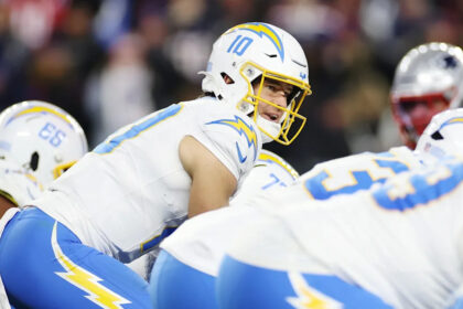 Mike McDaniel hopes to get QB Justin Herbert to "own the position" in a way he never has