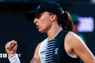 Swiatek drops just one game to set up Osaka meeting